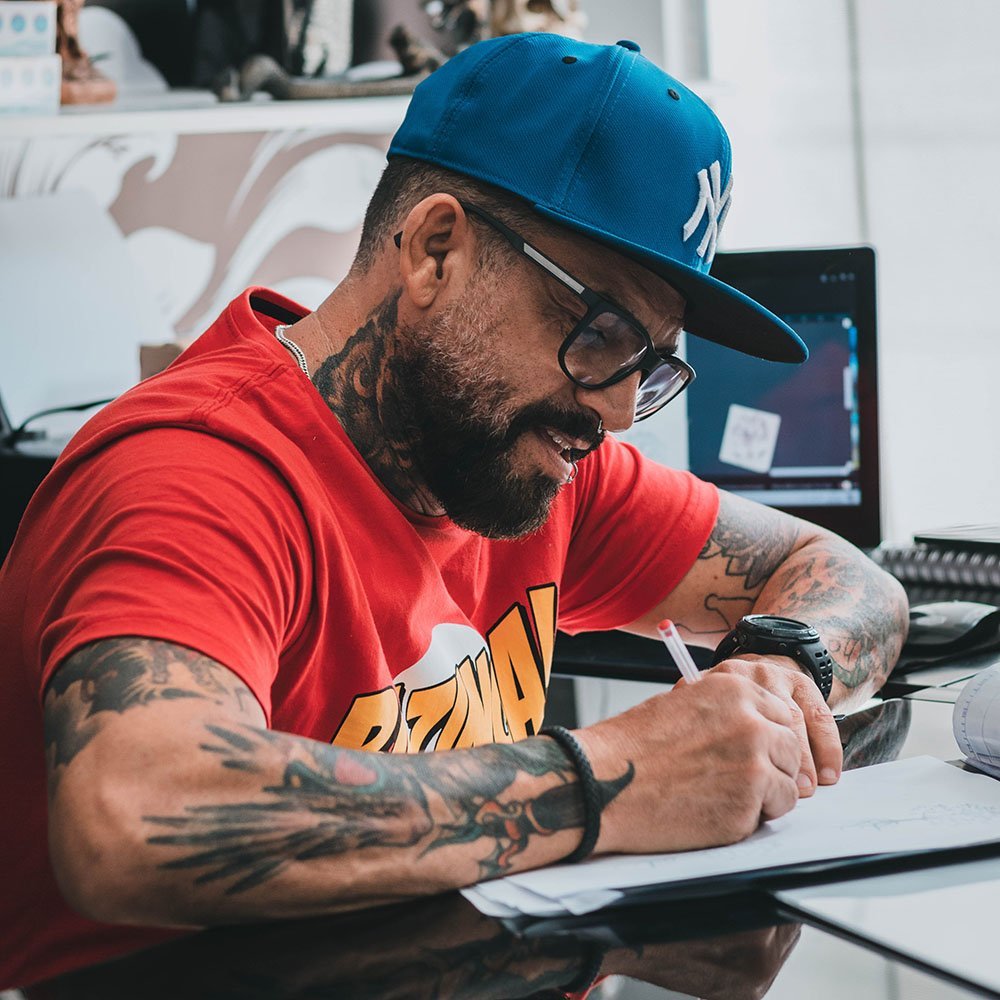 Designer creating art on a notepad