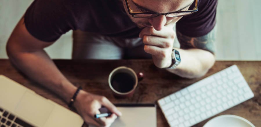 Photograph of a designer looking at a screen